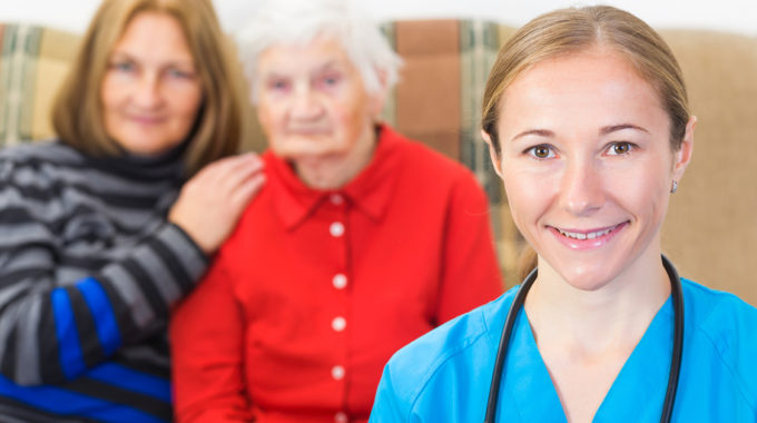 Hospice Nurse With A Mother And Daughter