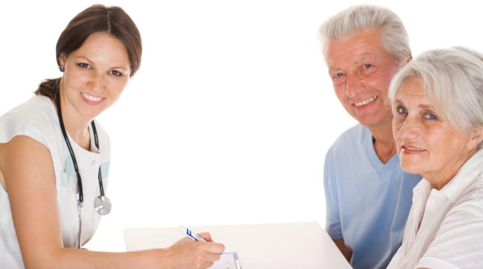 Photo Of A Retired Couple Discussing Hospice With A Nurse