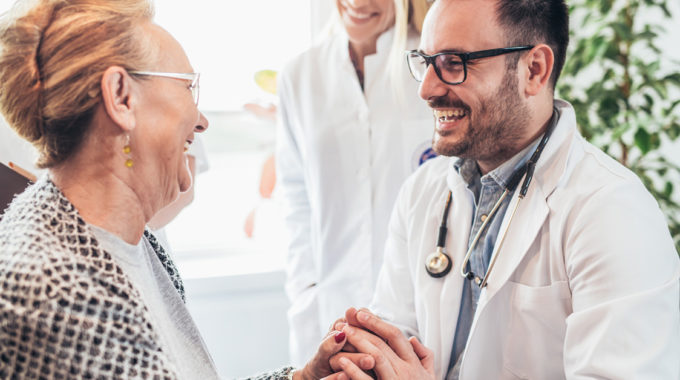 A Doctor Discussion Care With A Senior Patient
