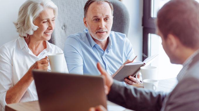 People Discussing End-of-life Care Documents Such As Advanced Directives