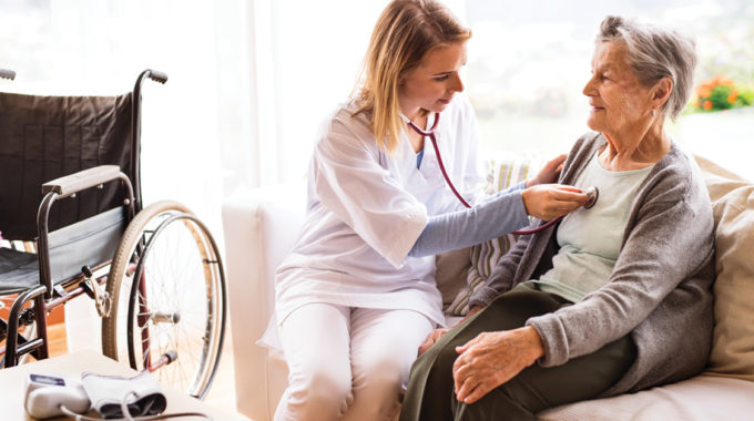 Image Of A Home Hospice Nurse And Patient