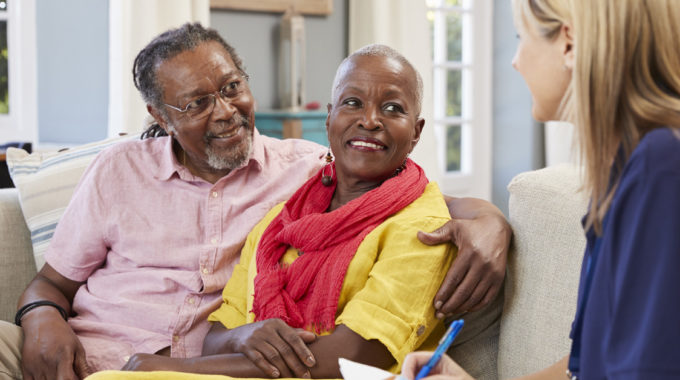 Photo Of A Hospice Nurse Describing The Hospice Program To A Home Health Patient And Spouse