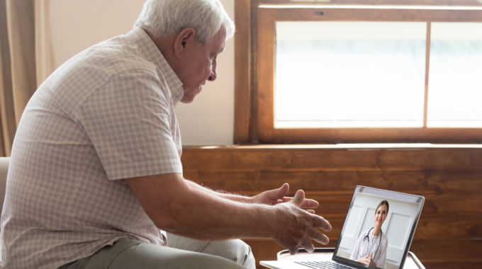 Senior Who Needs Hospice Having A Face-to-face Meeting With A Doctor Over Telehealth