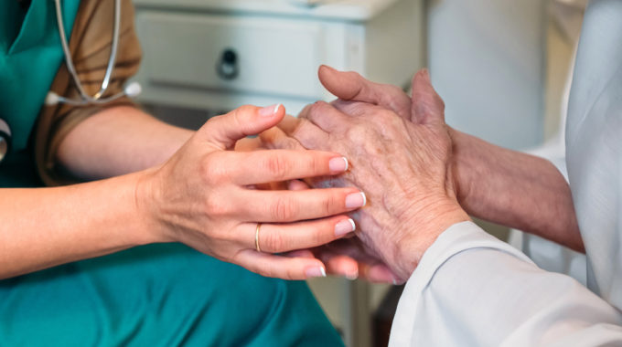 Doctor Listening To The Wishes Of A Dying Patient