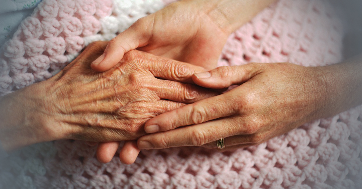Younger Person Holding Hands Of A Grandparent