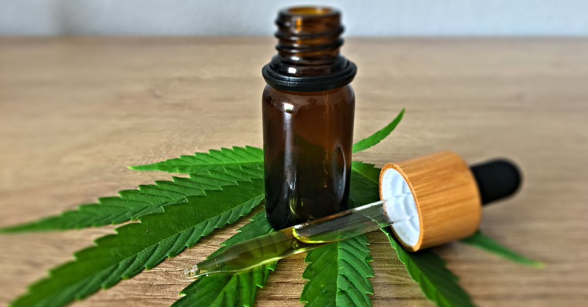 Cannabis Leave With A Dosage Dropper And Bottle