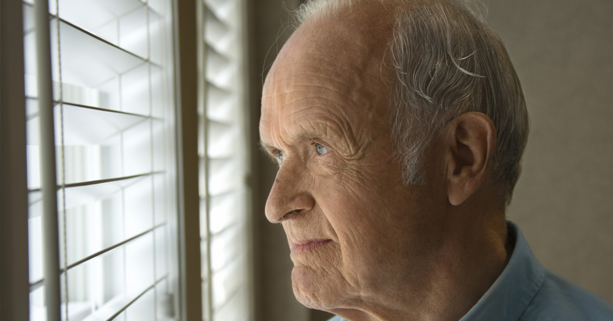 Elderly Gentleman Looking Out A Window.