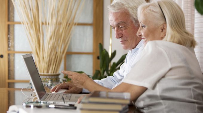 Senior Couple Researching Social Security Benefits While On Hospice Care