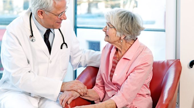 Doctor Speaking With An Elderly Lady