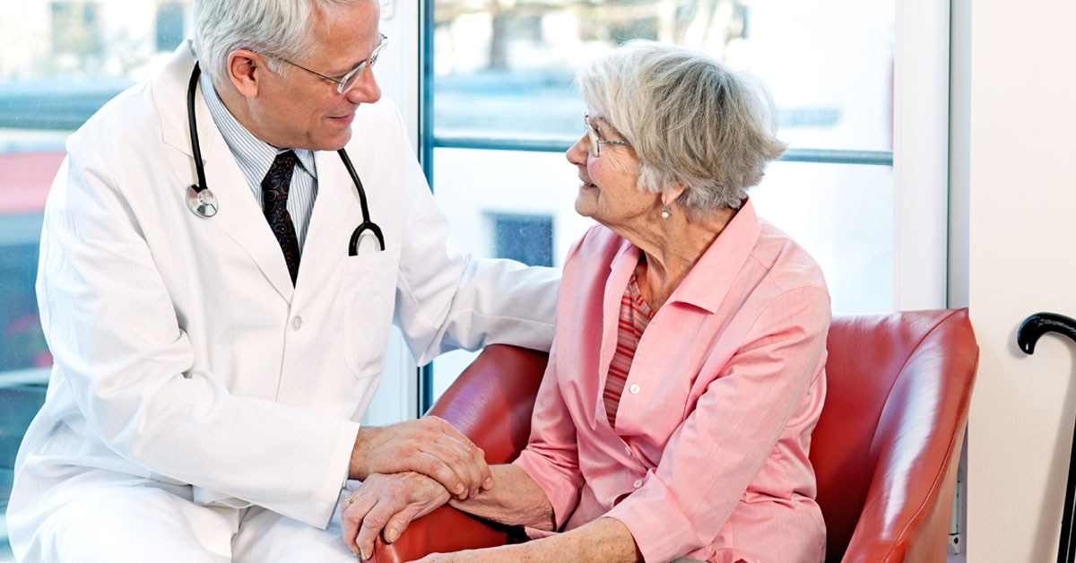 Doctor Speaking With An Elderly Lady