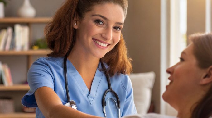 Hospice Nurse Providing Care To A Patient.