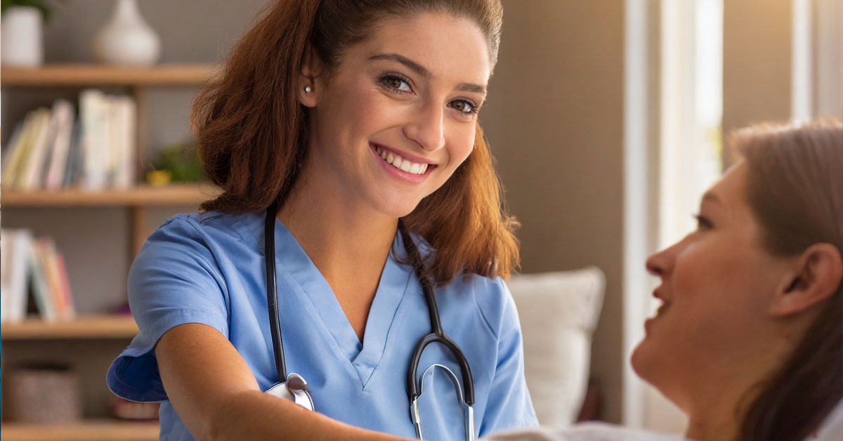 Hospice Nurse Providing Care To A Patient.